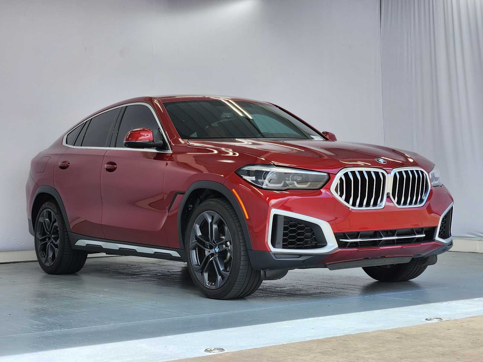 Certified Used 2023 Flamenco Red Metallic BMW xDrive40i image 2