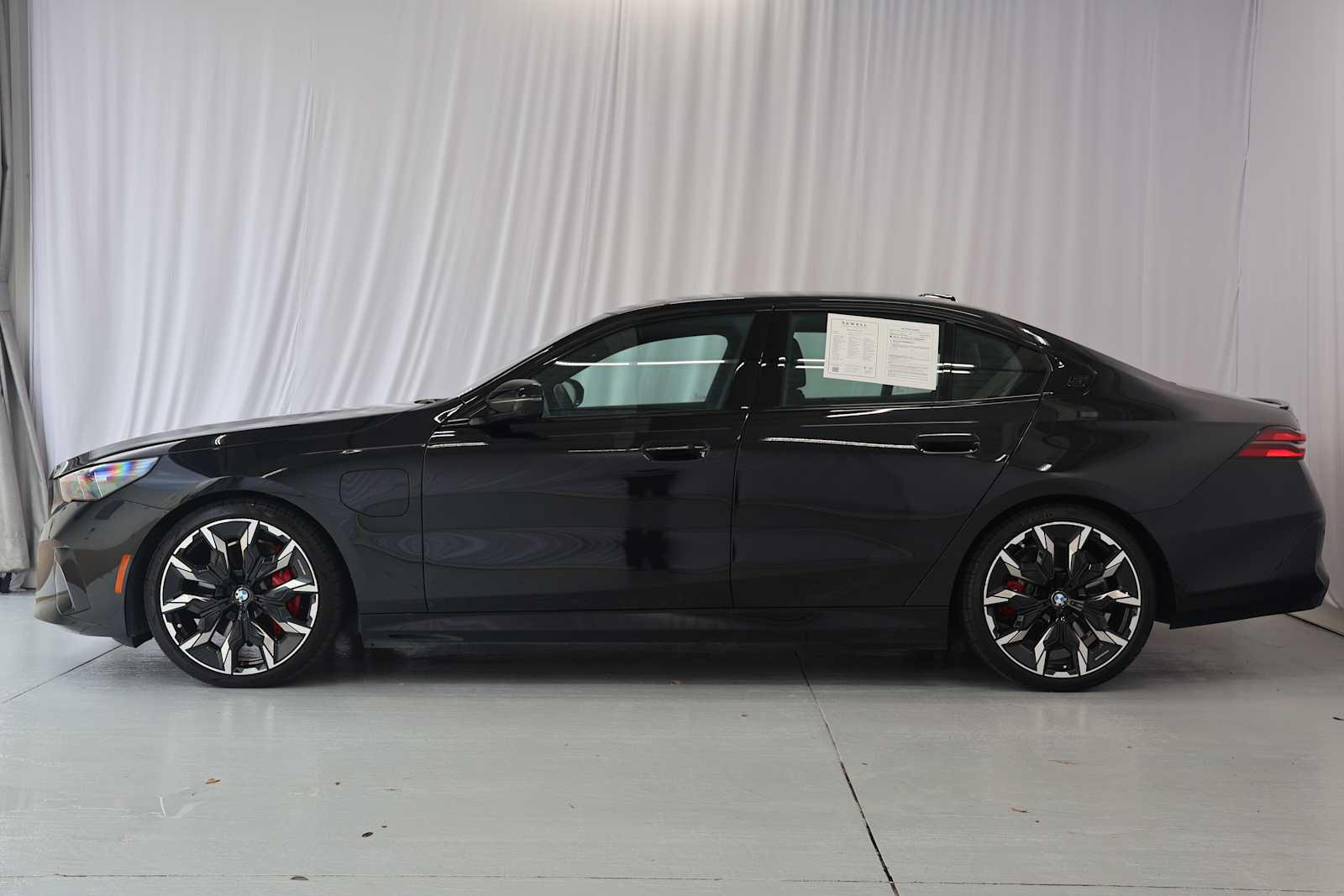 Certified Used 2026 Black Sapphire Metallic BMW 550e xDrive image 7