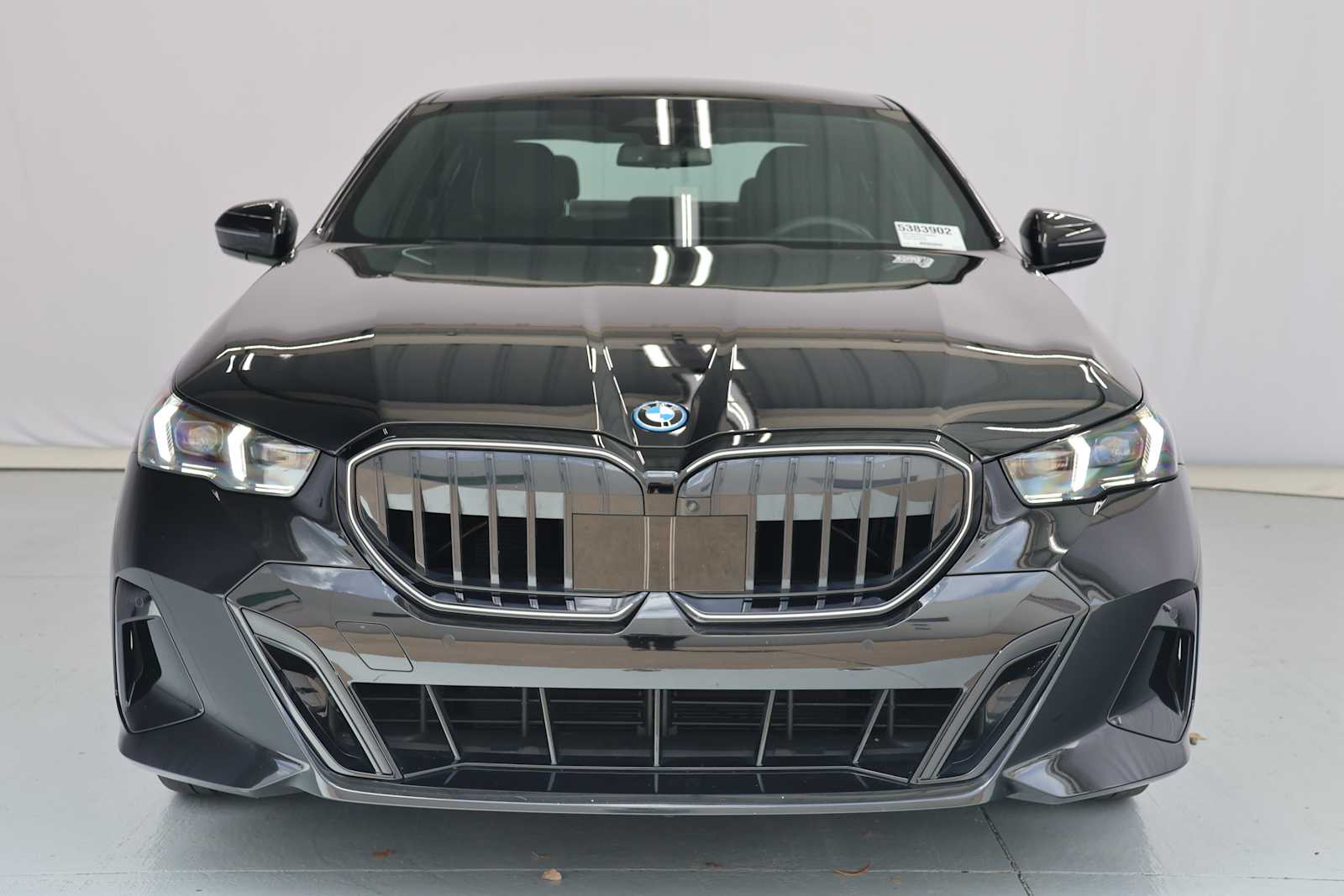 Certified Used 2026 Black Sapphire Metallic BMW 550e xDrive image 2