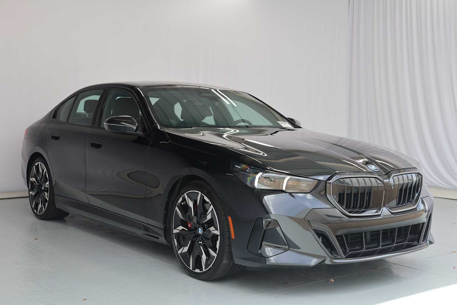 Certified Used 2026 Black Sapphire Metallic BMW 550e xDrive image 4