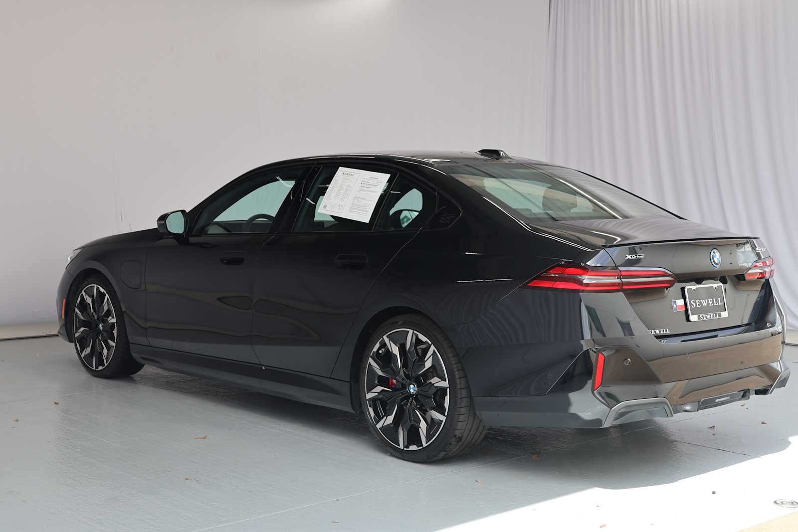 Certified Used 2026 Black Sapphire Metallic BMW 550e xDrive image 8
