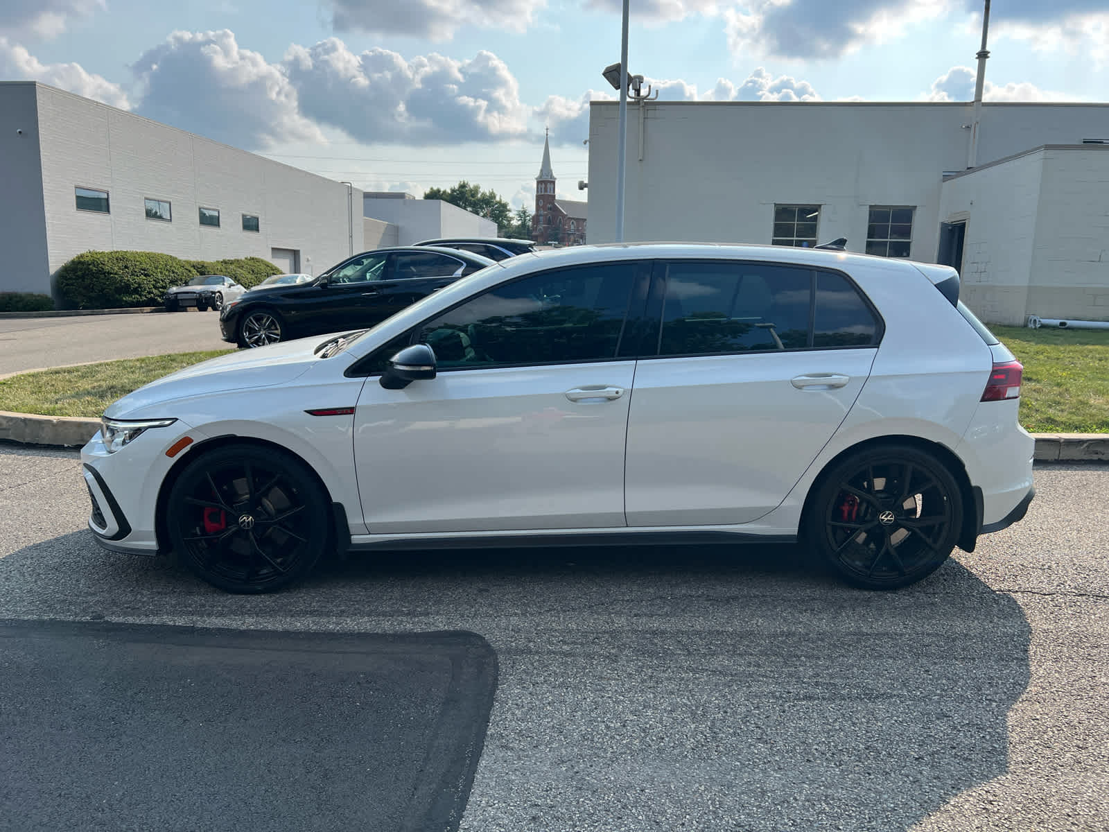2024 Volkswagen Golf GTI 380 SE Opal White Pearl w/ Black Roof at Cochran Mazda