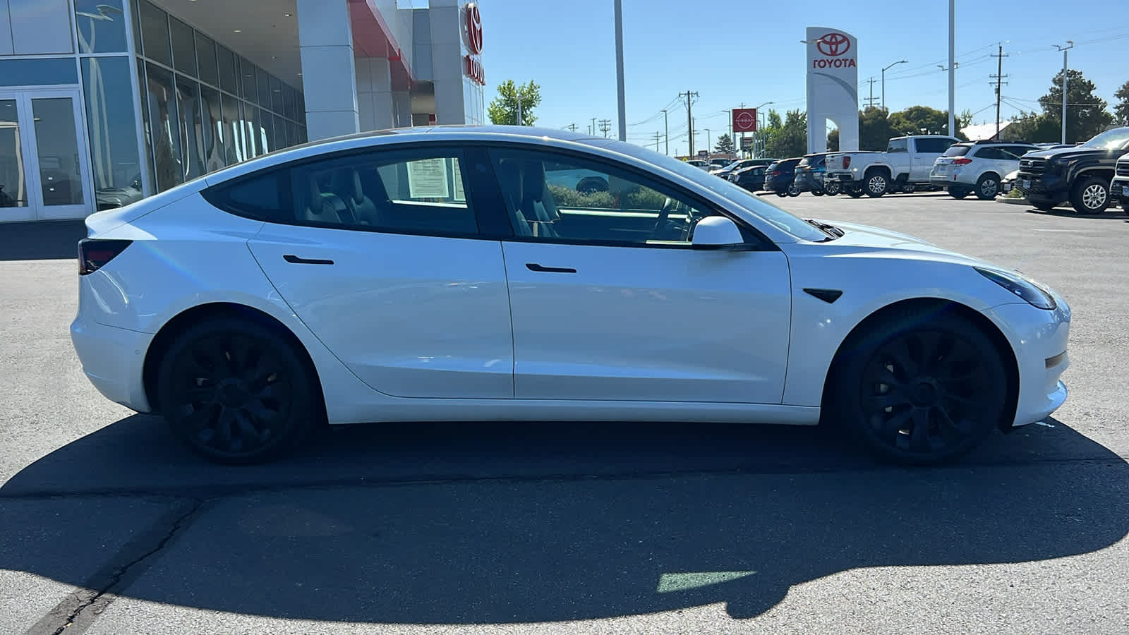 used 2022 Tesla Model 3 car, priced at $26,995