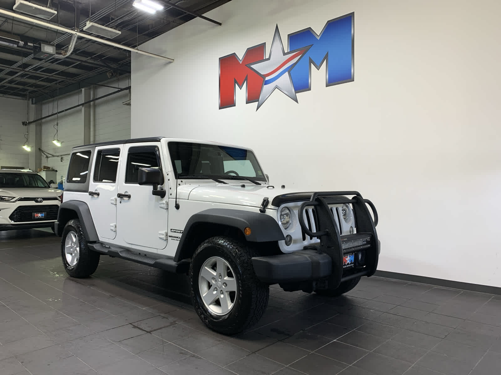 used 2015 Jeep Wrangler Unlimited car, priced at $25,489